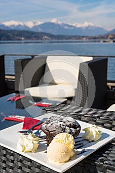 Delicious chocolate muffin served with vanilla ice cream.