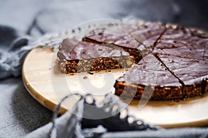 delicious chocolate tart with crunchy base in window light, equals foodporn