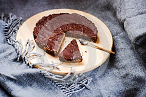 delicious chocolate tart with crunchy base in window light, equals foodporn