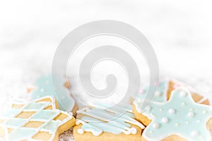 Delicious christmas cookies with blue frosting or royal icing, copyspace