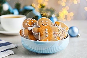 Delicious Christmas cookies in bowl on light table