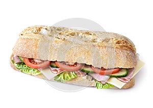 Delicious ciabatta sandwich with ham, tomatoes, fresh salad and cucumber