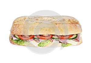 Delicious ciabatta sandwich with ham, tomatoes, fresh salad and cucumber