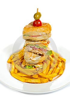 Delicious club sandwich with french fries
