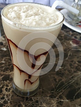 Delicious Cold coffee with choocolate in mirror glass