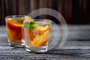 Delicious and cold peach cocktail