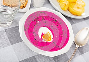 Delicious cold yogurt beetroot soup Holodnik with cucumber decorated by egg