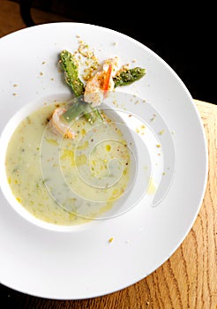 Delicious cream soup with asparagus and shrimp