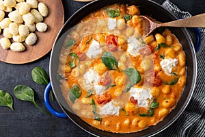 Delicious creamy gnocchi with tomato sauce, spinach and mozzarella