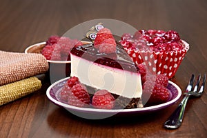 Delicious creamy raspberry cake on the table stock images