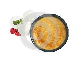 Delicious creme brulee with scoops of ice cream, fresh raspberries and mint on white background, top view