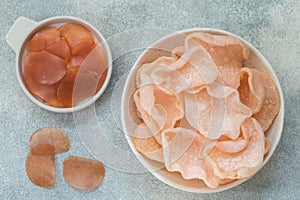 Delicious crispy chips made of starch, flour and shrimp. Bowl of Krupuk prawn crackers