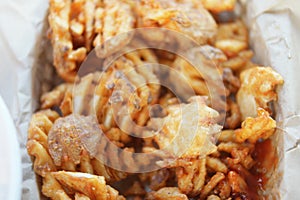 Delicious crisscross fries in paper container