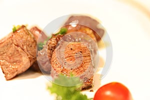 Delicious cubic beef steak on a white dish