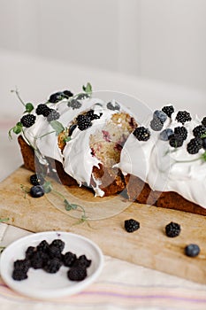 Delicious cupcake with berries and herbs on the table