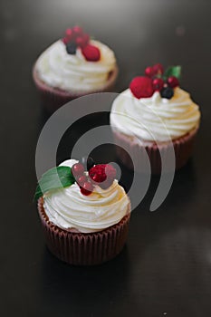 Delicious cupcakes with berries