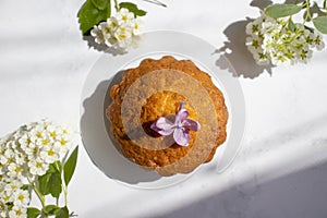 Delicious cupcakes with flowers  pastry kitchen  handmade on a light background