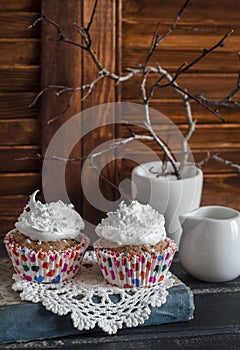 Delicious cupcakes on a wooden table. Tea time.