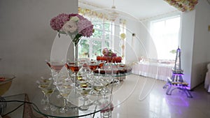 Delicious decorated sweets and fruits on tables for wedding reception, cocktails party catering in restaurant