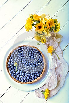 Delicious dessert blueberry tart with fresh berries, sweet tasty cheesecake, berry, bog bilberry, whortleberry pie