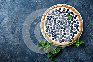 Delicious dessert blueberry tart with fresh berries and whipped cream, sweet tasty cheesecake, berry pie