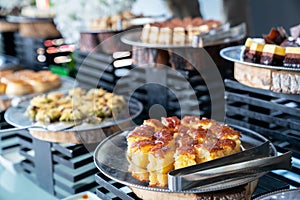 A delicious dessert buffet with various sweet bakery in a restaurant or hotel