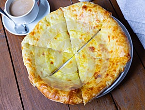 Delicious dish khachapuri Iveria with suluguni cheese photo