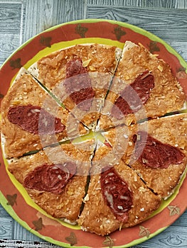 Delicious dog food pizza served to pet dog as a special treat of celebration