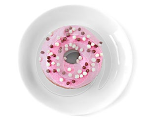 Delicious donut on saucer