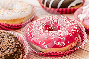 Delicious donuts glazed with sprinkles