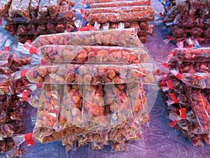 Delicious dried fruits of pleasant flavor wrapped in plastic photo
