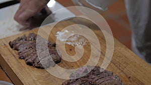 Delicious dry aged and smoked bbq brisket. Chef cuts and prepares this gorgeous piece of meat for a tasty meal.