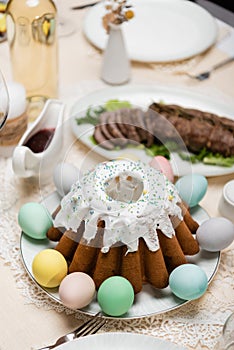 delicious easter cake with painted eggs
