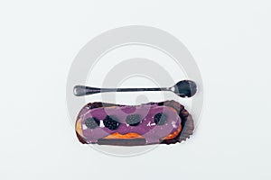 Delicious eclair cake with icing and blackberries