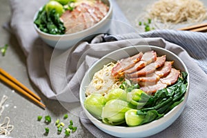 delicious egg noodle with red pork and vegetable in bowl decoration