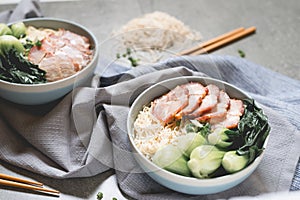 Delicious egg noodle with red pork and vegetable in bowl