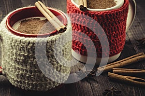 Delicious eggnog in red and white mugs with cinnamon/delicious e