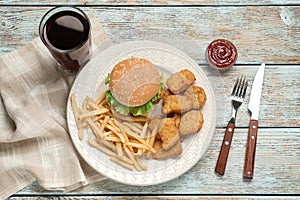 Delicious fast food menu on white wooden table, flat lay