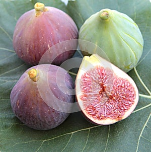 Delicious figs on a fig leaf, close up.