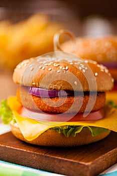 Delicious fish burgerserved with fresh french fries