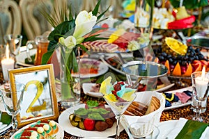 Delicious food festively served on the table for banquet, restaurant interior