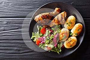 Delicious food: grilled chicken drumsticks with new potatoes and