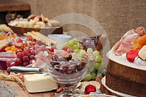 A Delicious Food Platter of Fruit, Nuts, Cheese, Dips, Deli Meat