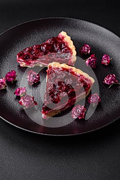 Delicious fragrant sweet pie with cherry berries on a ceramic plate