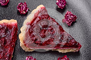 Delicious fragrant sweet pie with cherry berries on a ceramic plate