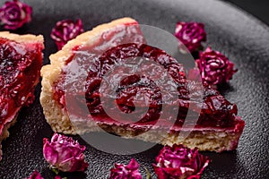 Delicious fragrant sweet pie with cherry berries on a ceramic plate