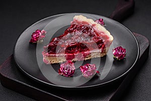 Delicious fragrant sweet pie with cherry berries on a ceramic plate