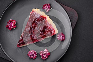 Delicious fragrant sweet pie with cherry berries on a ceramic plate