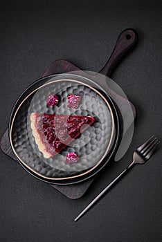 Delicious fragrant sweet pie with cherry berries on a ceramic plate