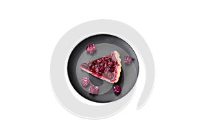 Delicious fragrant sweet pie with cherry berries on a ceramic plate